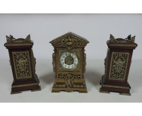 A good quality late 19th Century / early 20th Century Clock Set, the clock in an elegant pierced case in the shape of a templ