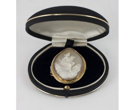 A 9ct gold framed carved oval Cameo Brooch, with heavenly figure playing a lyre, and with safety tie chain. (1)