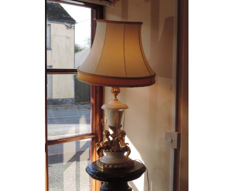 A very attractive heavy white marble and ormolu mounted Table Lamp, with three large gilt cherubs surmounted and with white p