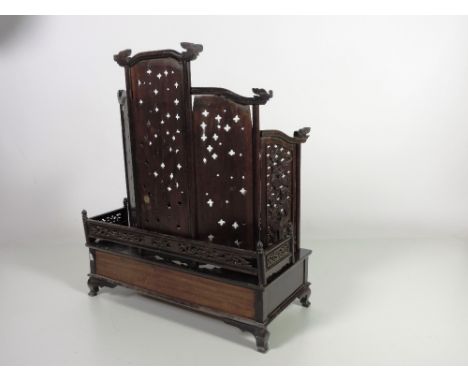 An unusual profusely carved 19th Century Oriental hardwood Table Shrine, the five panel graduating pierced back decorated wit