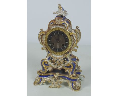 An attractive 19th Century Continental porcelain Mantle Clock, blue ground and floral decoration, profusely decorated with gi