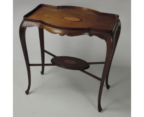 An unusual Edwardian inlaid mahogany Occasional Table, the top with large shell inlaid panel, tray top rim and bowed sides, w