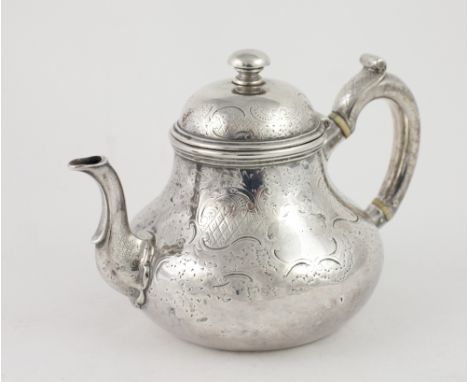 An early Victorian English silver Teapot, of Queen Anne design, with attractive decoration of flowers, scrolls, and latticewo