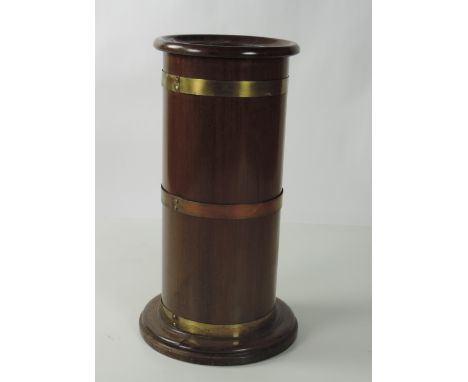 A brass bound circular mahogany Stick & Umbrella Stand, with tin liner, 66cms (26") high. (1)