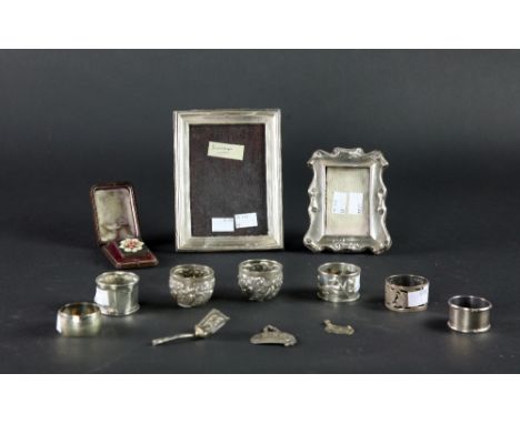 Two small silver Photograph Frames, two silver Wine Labels, a small silver Caddy Spoon, Napkin Rings and other items, a lot. 