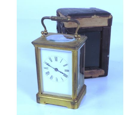 A good heavy 19th Century brass Carriage Clock, with double drum movement, in original leather carrying case (dam.). (1)

Pro