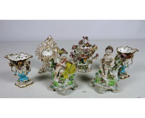 A pair of early 19th Century English porcelain Figures, of Putti seated on flower encrusted rocks, approx. 18.5cms (7 1/4") h