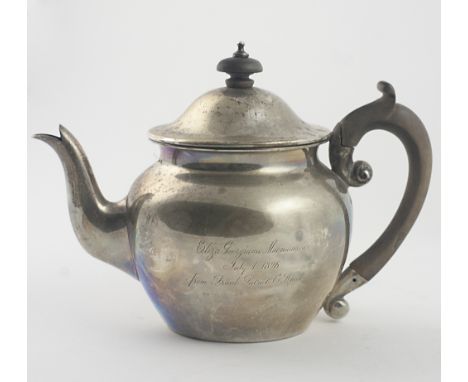 A small plain English silver bullet shaped Teapot, with MacNamara crest, London c. 1896, approx. 14 ozs, with wooden handle, 