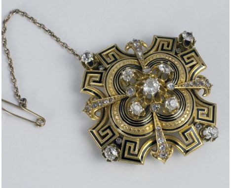 A very attractive and unusual 18ct gold diamond set Brooch, decorated with a Greek key pattern in black enamel, and with appr
