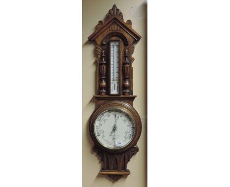 A good Edwardian carved oak Hanging Aneroid Wall Barometer / Thermometer, by Benetfink & Co., Cheapside, London, 90cms (35") 