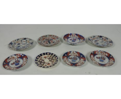 A small Imari Saucer Dish, three smaller matching ditto, plaques, three antique Oriental Plates, and another item. A lot. (8)