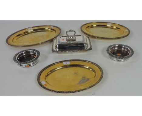 A good rectangular silver plated Victorian Vegetable Dish, Cover & Handle, a set of 3 graduating gilded oval Meat Dishes, by 