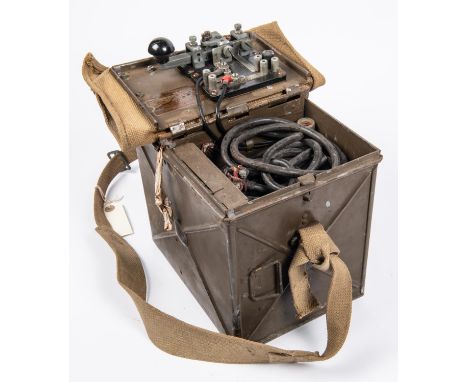 A WWII British Army Electric Morse signalling lamp, in its steel and webbing case complete with 4 part screw together ground 