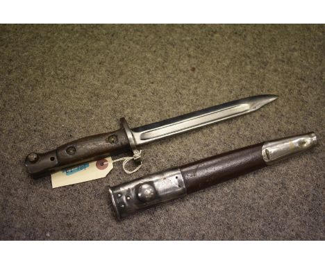 A BRITISH No.6 BAYONET, 19cm clipped back fullered blade, regulation hilt with wooden grips, contained in its steel scabbard.