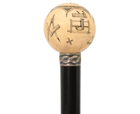 A LATE 19TH/EARLY 20TH CENTURY MASONIC WALKING CANE, the spherical ivory pommel carved over all with Masonic symbols and the 