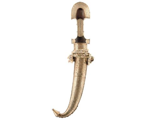 A MOROCCAN JAMBIYA OF MASSIVE PROPORTIONS, 29cm blade, characteristic white metal mounted hilt decorated with panels of scrol