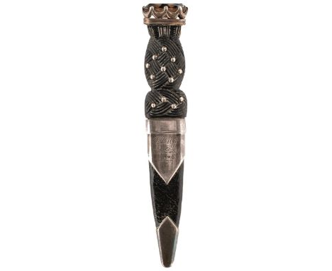 A MINIATURE SILVER MOUNTED SGIAN DUBH, 6cm fullered blade with faceted back edge etched with the owner's name, characteristic