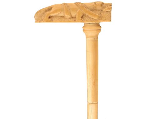 A 19TH CENTURY INDIAN IVORY SECTIONAL WALKING CANE, the handle carved as a tiger battling a large serpent, the tapering haft 