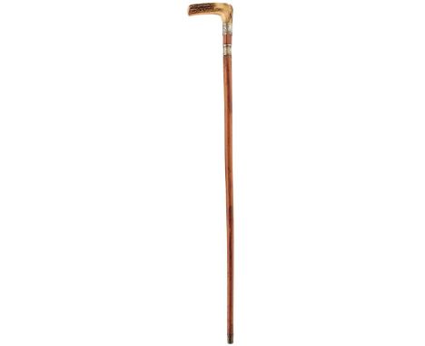 A MALACCA SWORD STICK, the handle of natural antler above foliate white metal collar, 65cm twist lock action rectangular sect