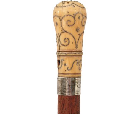 AN 18TH CENTURY WALKING CANE, the ivory and pique work handle decorated with scrolls, flowerheads and the letter M and pierce