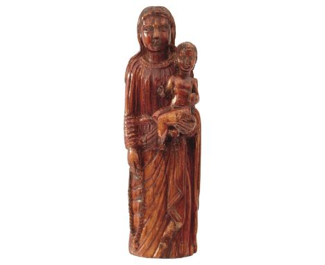 GOA, 17TH CENTURY, A CARVED IVORY GROUP OF THE VIRGIN MARY AND CHRIST CHILD, russet stained, 15cm high. From an established W