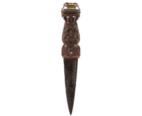 A 19TH CENTURY SCOTTISH SGIAN DUBH, 9.5cm fullered blade with faceted back edge, characteristic carved wooden hilt decorated 