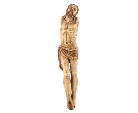 GOA, 17TH CENTURY, A CARVED IVORY CORPUS CHRISTI, arms lacking, 21.5cm high. From an established West Country Collection.