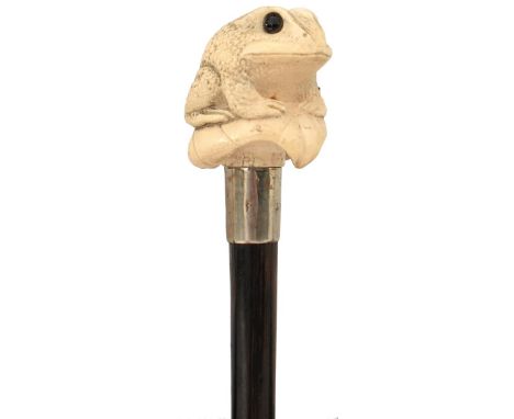 A 19TH CENTURY WALKING CANE, the ivory handle carved as a frog sitting on a lily pad, white metal collar, rosewood haft, long