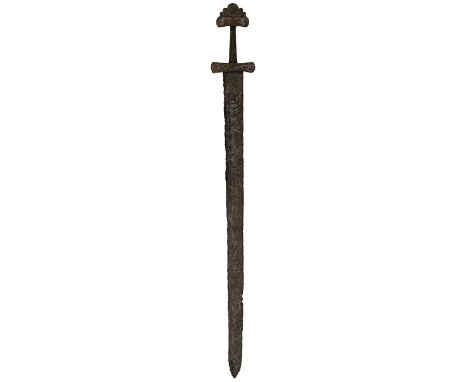 A VIKING SWORD OF PETERSEN TYPE K, 77.5cm blade in excavated condition, pattern welded double edged blade, characteristic hil