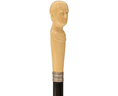 A LATE 19TH/EARLY 20TH CENTURY WALKING CANE, the ivory handle carved as the bust of a man (possibly Cicero), and inscribed Ja