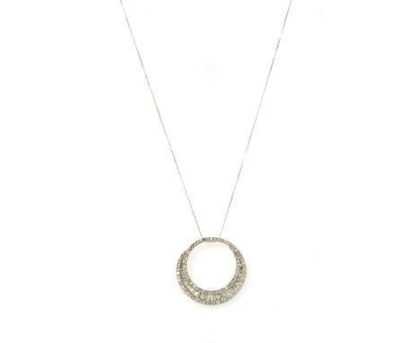 A white gold diamond pendant, the circular openwork pendant with a row of graduated baguette cut diamonds channel set to the 