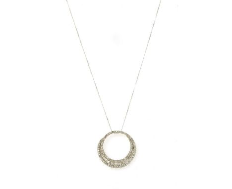 A white gold diamond pendant, the circular openwork pendant with a row of graduated baguette cut diamonds channel set to the 