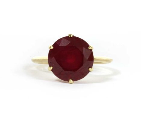 A gold single stone fracture filled ruby ring, a circular mixed cut fracture filled ruby, with a stated weight of 10.00ct, ap