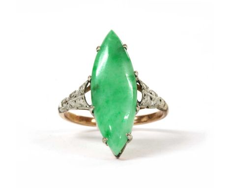 A gold jade ring, with a marquise cabochon jadeite jade, claw set, to tapered shoulders and a 'D' section shank, tested as ap