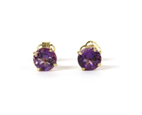 A pair of gold single stone amethyst stud earrings, with a circular mixed cut amethyst, approximately 5mm, four claw set to p