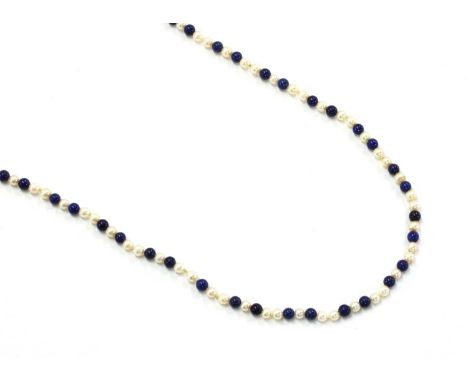 A single row opera length uniform cultured freshwater pearl and lapis lazuli bead necklace, the pearls approximately 4.5 to 5
