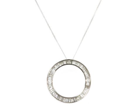 A white gold diamond pendant, the openwork circular pendant channel set with baguette and tapered baguette cut diamonds, to c