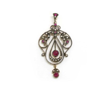 A silver and gold, ruby, split pearl and diamond pendant, a circular mixed cut ruby, rub set, to the centre of an articulated