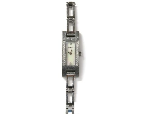 A ladies' stainless steel Gucci bracelet watch, ref. 3900L, a rectangular mother-of-pearl dial with diamond set markers at '1