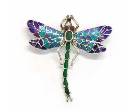 A silver plique-à-jour enamel, ruby and emerald set dragonfly brooch/pendant, with circular mixed cut ruby set eyes and an ov