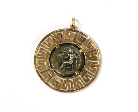 A gold and silver pendant, with a silver token in the style of an Alexander the Great silver drachm, rub set in gold to a pie