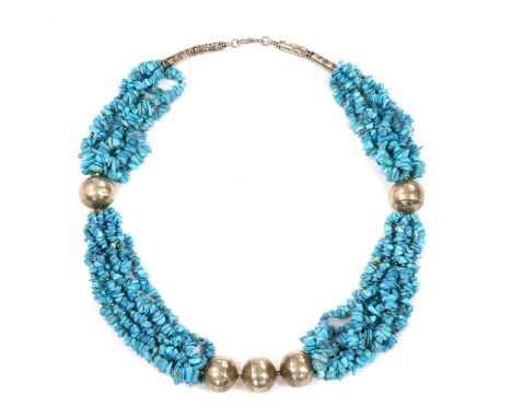 A silver and turquoise necklace, possibly by Sandra D'Auriol, with six rows of tumbled turquoise beads, with silver spherical