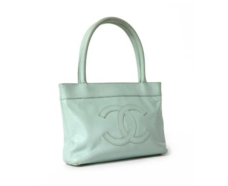 A Chanel baby blue leather small Monte Carlo tote, dual-rolled handles gold tone hardware, magnetic snap closure, opening to 