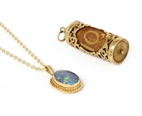 A 9ct gold ten shilling note charm, London 1976, 45mm long, together with a gold opal triplet pendant suspended on a 9ct gold