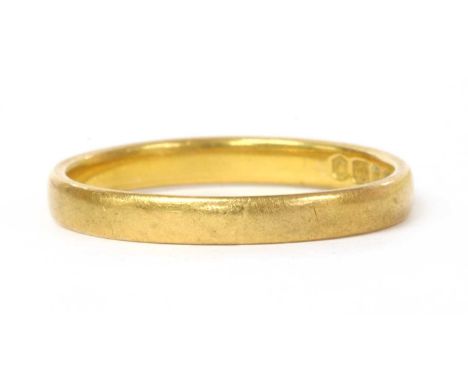 A 22ct gold flat section wedding ring, approximately 2.5mm wide, London 1953, 2.84gCondition report: Ring is out of shape; ov