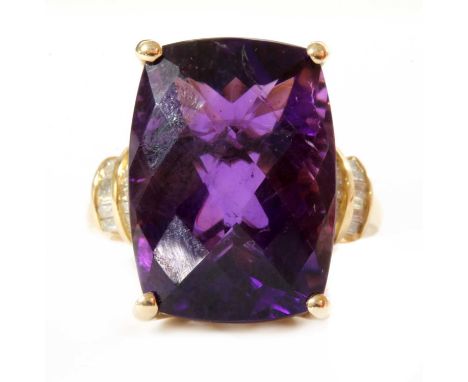 A gold amethyst and diamond ring, a cushion shape amethyst with a chequer cut crown, approximately 18 x 13mm, claw set, with 