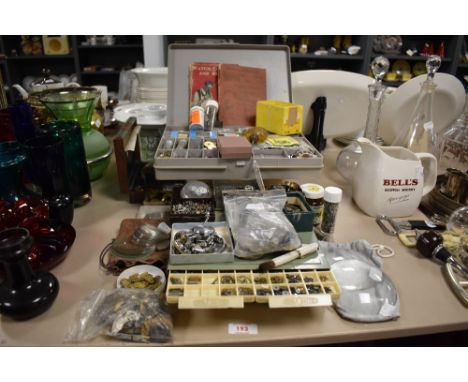 A extensive collection of horologist parts and tools including lenses, mechanical parts, watch faces etc.