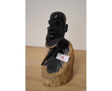 A lignum vitae carved maize picker bust, with pipe, incised signature to underside.