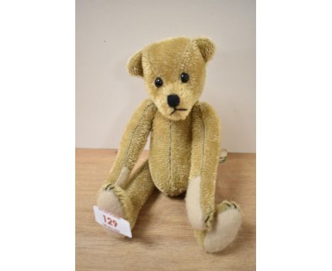 A 20th Century artist's teddy bear, by Bears of Mimizan, having boot button style eyes, a golden mohair covered body, and joi