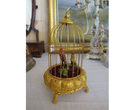 A 20TH CENTURY MUSICAL AUTOMATON WITH TWO BIRDS IN A GILDED CAGE, H 25 cm